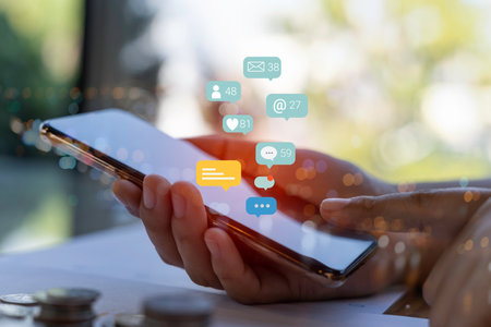 Contact us or Customer support hotline people connect. Business people using a smartphone with the (email, call phone, mail) icons.の写真素材
