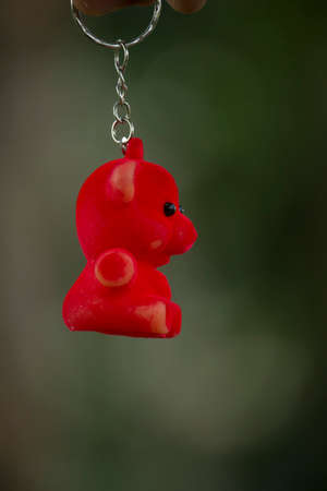 A small red colour doll. Blurred background.の写真素材