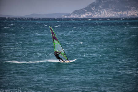 Windsurfers in the Mediterranean Sea. Windsurfer on the waves.の写真素材