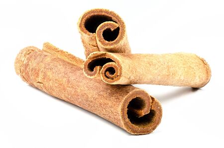 Bunch of cinnamon sticks isolated on seamless white background