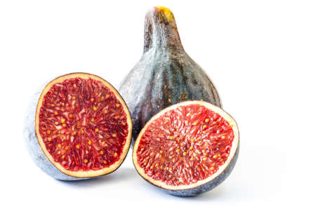 Fresh cut ripe fig fruit isolated on white background