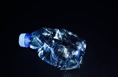 Bottle isolated on dark backgroundの写真素材