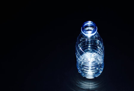 Bottle isolated on dark backgroundの写真素材