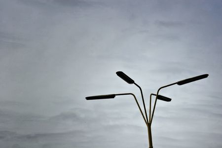 street lantern in front of a darken sky