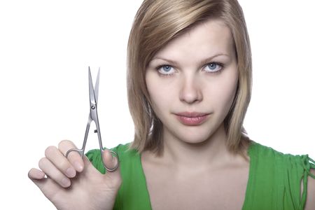 beautiful blonde girl with scissors, isolated on whiteの写真素材