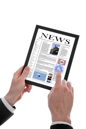 a male hand holding a touchpad pc showing a newspaper, isolated on whiteの写真素材