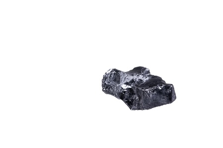 piece of a small Anthracite coal, isolated on white with a shallow depth of fieldの写真素材