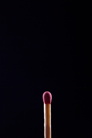 macro shot of match head, on dark backgroundの写真素材