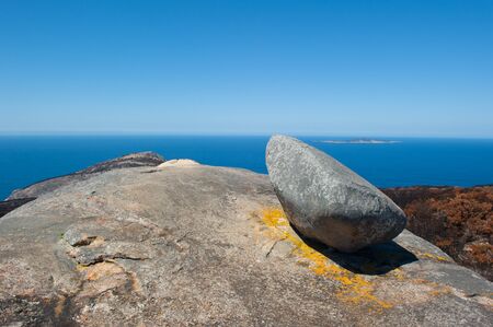 Scenic aerial panorama view along coast of Torndirrup National Park, Albany, Western Australia, burnt vegetation, Southern Ocean, blue sky, copy space.の写真素材