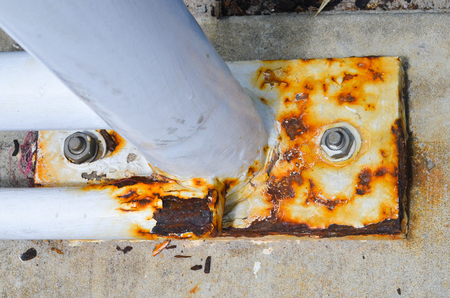 Detailed close up of Rusty texture of corroded metal pole, weathered broken surface, copy space.