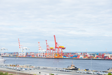 Fremantle, Western Australia - February 12, 2017: Cargo container and cranes at wharf in Fremantle...
