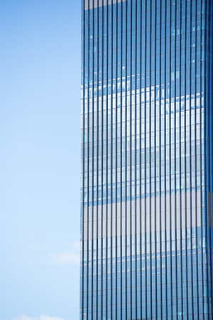Conceptual image of textured facade of modern design skyscraper office buildings in city business...