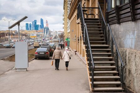 Moscow Garden Ring avenue, fence and trees of Gorky Park (left), skyscrapers of the International Business Center Moscow City (back)のeditorial素材
