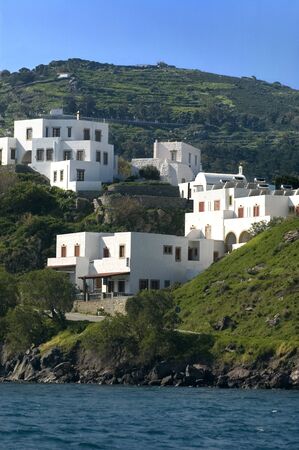 White houses on the shoreline of the Island of Patmos, Greeceの写真素材