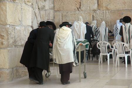 Men at the Wailing Wall, also know as the Western Wall, in Jerusalem, Israelの写真素材