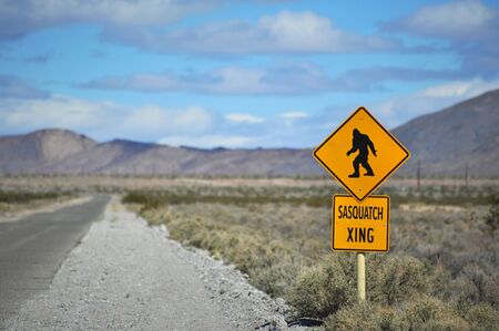 A comical traffic sign in the desert warning of sasquatch crossingの写真素材