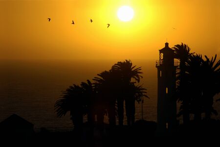 Silhouette of the Point Vicente Lighthouse in Palos Verdes, California at sunsetの写真素材