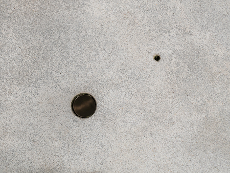 grey granite floor with holesの写真素材