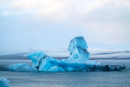 an icebrg floating in the JÃ¶kulsÃ¡rlÃ³n lagoon