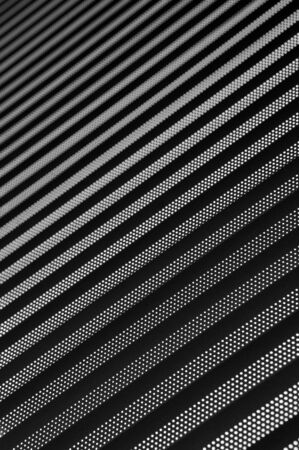 background consisting of light and dark stripes of diagonally with a gradual blurringの写真素材