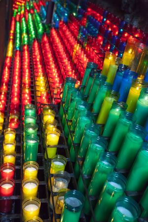 many colored, burning candles standing in rows, Spainの写真素材