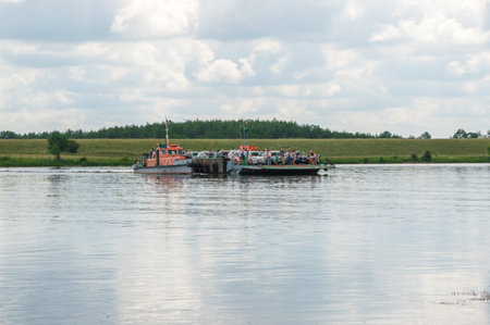 Gdansk Sobieszewo, Poland - June 17, 2017: Ferry with unidentified people on dead Vistula at Sobieszewo Island.のeditorial素材