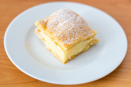Carpathians on white plate with wooden backgound.