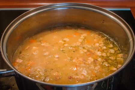 Polish yellow split pea soup in potatoes in Poland.の写真素材