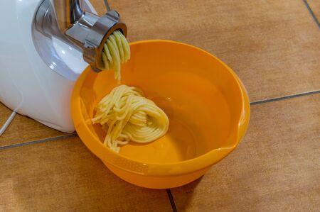 Mashing boiled potatoes for the last.の写真素材