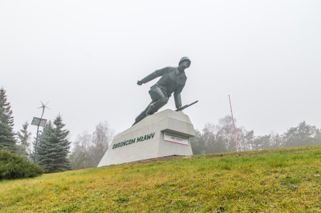 Mlawa, Poland - November 25, 2017: Monument to defencer of the Mlawa who fight at September 1-3, 1939. Monument at cloudly day.のeditorial素材