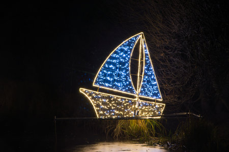 Gdansk, Poland - December 5, 2017: Ship illumination at night in Oliwa park in Gdansk.のeditorial素材