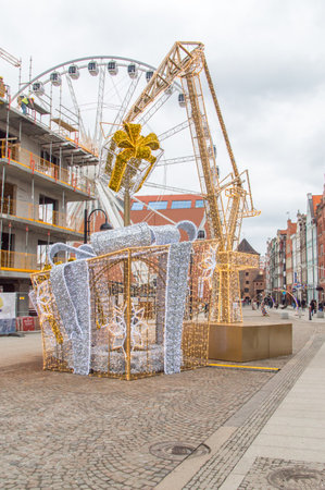 Gdansk, Poland - December 7, 2017: Gifts and crane as christmas decorations in the old town of Gdansk.のeditorial素材