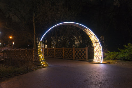 Gdansk, Poland - December 8, 2017: Illuminated gate as winter christmas illumination at night in Oliwa park in Gdansk.のeditorial素材