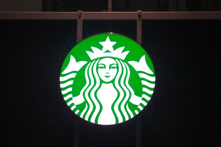 Gdansk, Poland - December 9, 2017: Starbucks logo coffee company at night time.のeditorial素材