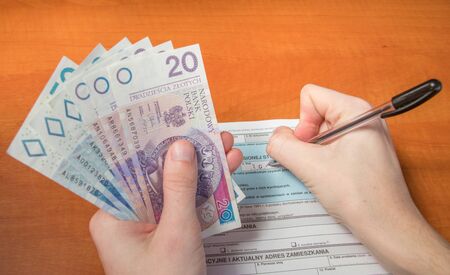 Man filling Polish individual income tax form PIT-37.の写真素材