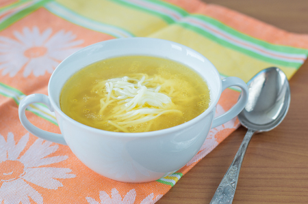 Traditional Polish chicken bouillon in white bowl.の写真素材