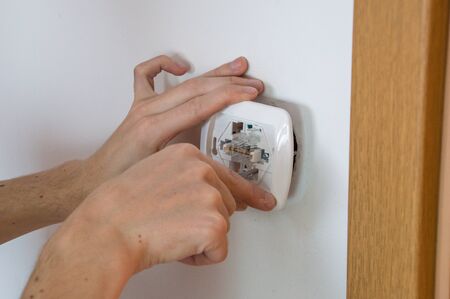Close-up of electrical installation. New electrical light switch.の写真素材
