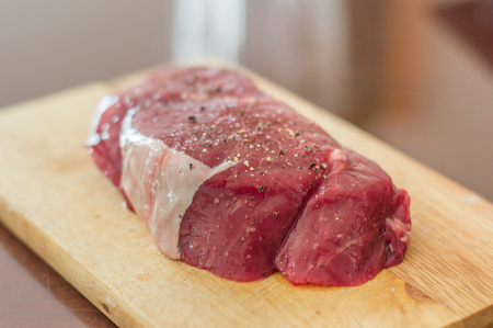 Raw steak meat with salt and pepper.の写真素材
