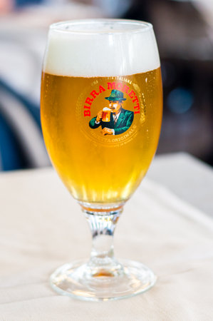Milan, Italy - May 31, 2018: Glass of Italian Birra Moretti beer.のeditorial素材