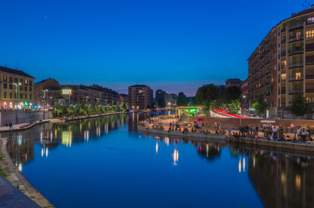 Milan, Italy - May 31, 2018: People at Darsena del naviglio canal at night.のeditorial素材