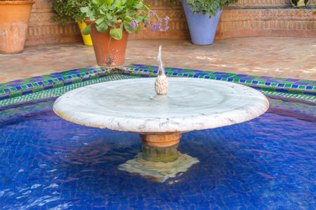 Marrakech, Morocco - June 3, 2018: Water fountain at Majorelle Garden (Jardin Majorelle).のeditorial素材