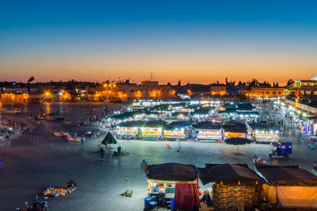 Marrakech, Morocco - June 5, 2018: Crowd in Jemaa el-Fnaa square at dusk time.のeditorial素材