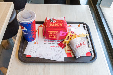 Barcelona, Spain - June 6, 2018: Restaurant Menu with Tower sandwich, Pepsi and french fries.のeditorial素材