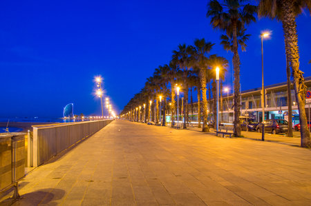 Barcelona, Spain - June 8, 2018: Boardwalk next to beach in Barcelona at night.のeditorial素材