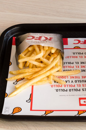 Barcelona, Spain - June 6, 2018: KFC french fries.