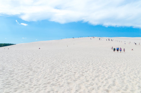Leba, Poland - August 7, 2018: People on Lacka dune at Slowinski National Park.のeditorial素材