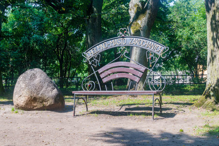 Wejherowo, Poland - August 2, 2018: Bench of Chelmno - city of lovers at park in Wejherowo.のeditorial素材