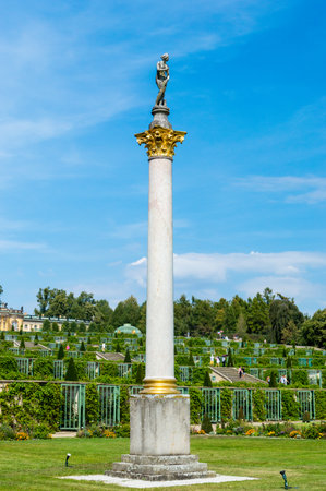 Potsdam, Germany - August 17, 2018: Column with Sculpture in the Sanssouci Park.のeditorial素材