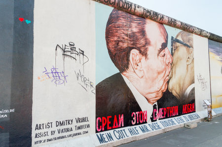 Berlin, Germany - August 16, 2018: Famous graffiti by Dimitry Vrubel with kiss between Brezhnev and Honecker known as My God, Help Me to Survive This Deadly Love.のeditorial素材