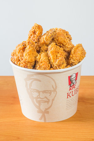 Pruszcz Gdanski, Poland - August 23, 2018: Fried chicken Hot Wings in bucket. KFC Hot Wings fried...